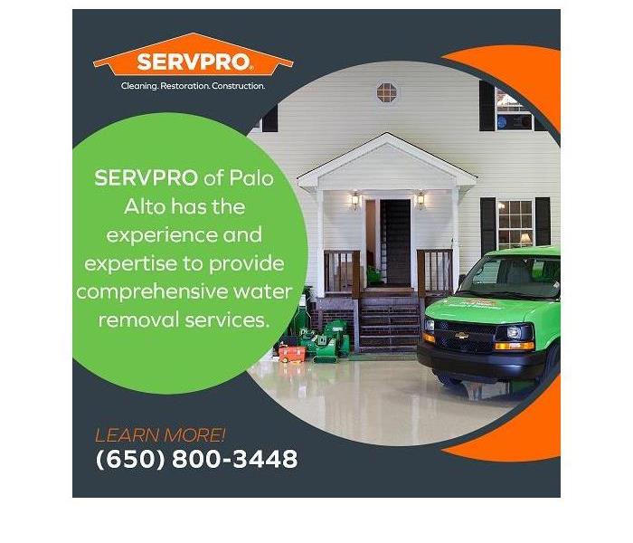 A SERVPRO truck is parked in front of a home that has suffered water damage